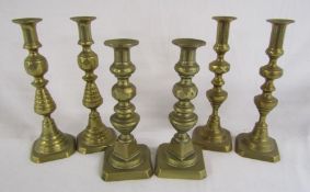 3 pairs of brass candlesticks