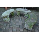 3 curved concrete garden benches on dolphin supports