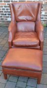 Leather armchair with brass tacks & a footstool