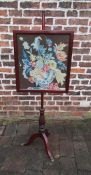 19th century mahogany pole screen with tapestry panel and brass feet approx. 136cm tall