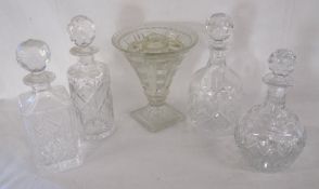 4 decanters and glass vase with insert