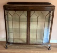 1920's bow fronted display cabinet in mahogany on ball & claw feet L 118cm Ht 120cm D 40cm