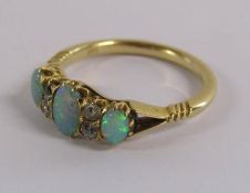 18ct gold diamond and fire opal ring - Ring Size N/O - total weight 3.3g