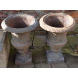 Pair of classical cast iron garden urns, Ht 45cm D 33cm