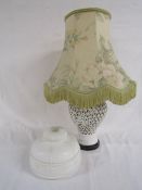 White fretwork ceramic table lamp (converted lidded urn) and white glass lamp shade