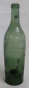 19th century green glass bottle with "kick in" base 30.5cm high