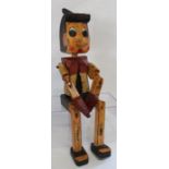 Wooden Pinocchio sitting figure 50cm high