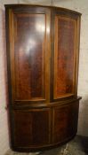 Large modern bow fronted corner cupboard in mixed wood Ht 220cm W 125cm