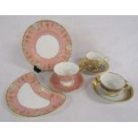 Royal Crown Derby 'Vine' pink set and 2 earlier cups and saucers gold with blue leaf pattern and