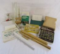 Collection of cake making and decoration tools, includes rolling pin, marble, number and alphabet