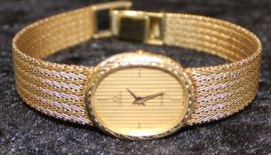 14ct gold Omega De Ville ladies wristwatch on Milanese type strap with quartz movement, the clasp