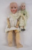 2 Armand Marseille 390 bisque head dolls (one dressed in clothes of the period)