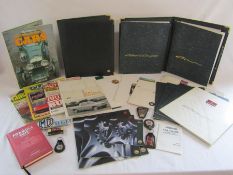 Collection of Rover MG car brochures, books and badges also includes leather folders also some