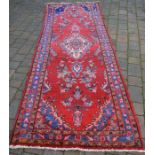 Red ground Persian Hamadan runner carpet 315cm by 108cm