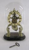 Skeleton clock with glass dome and key approx. 33cm high from floor to top of dome