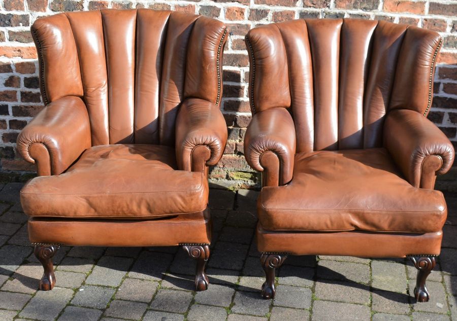 Pair of high back upholstered "Blake" leather armchairs by Terrad of Nottingham