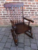 Dark wood rocking chair