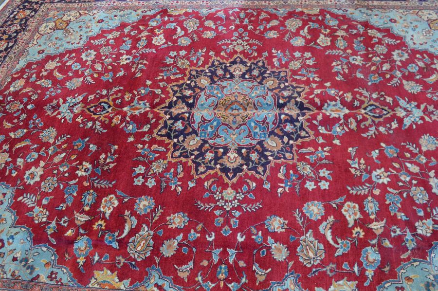 Rich red ground Persian Tabriz carpet with floral medallion & blue border 346cm by 259cm - Image 3 of 5