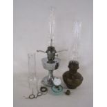 Collection of oil lamps includes Super Aladdin and a miniature with white glass chimney also extra