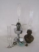 Collection of oil lamps includes Super Aladdin and a miniature with white glass chimney also extra