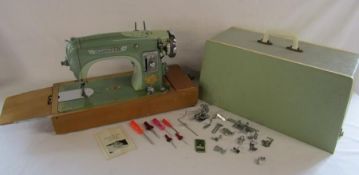 Musical Sunlik sewing machine includes attachments and instructions (no power or foot pedal)