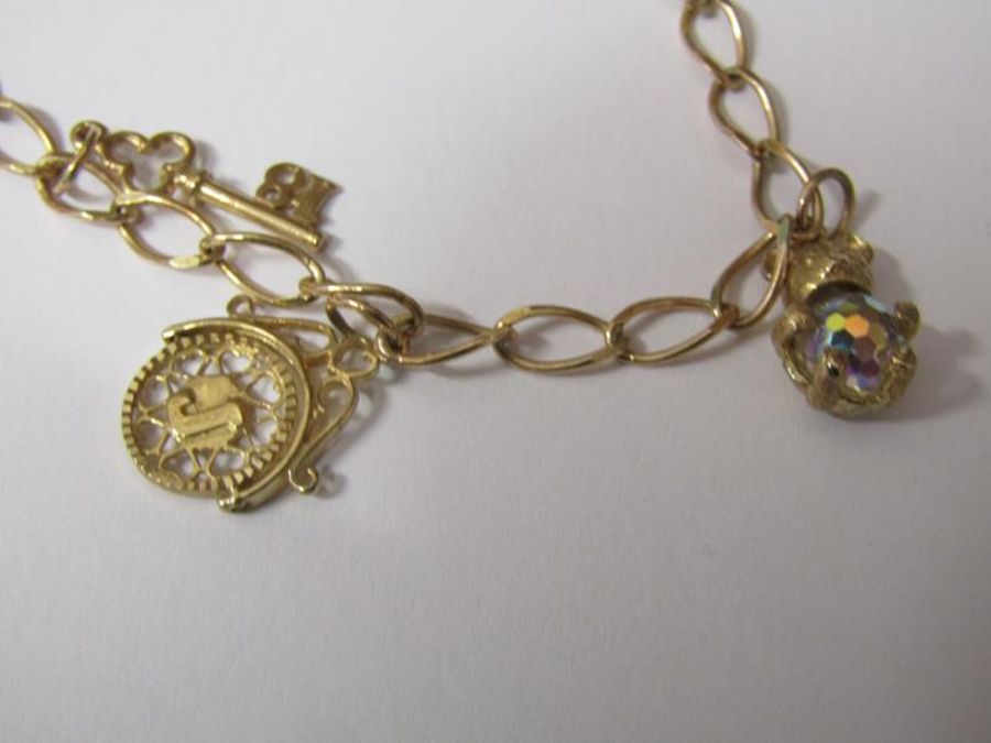 9ct gold charm bracelet marked 375, 6.9g - Image 2 of 2