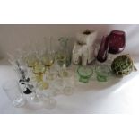 Collection of glassware includes coloured oversized glass, buoy, wine glasses and elephant plant