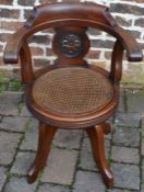 Victorian mahogany swivel chair by Rowan's with reversible split cane/upholstered seat