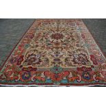 Large multi-ground Persian style carpet with central medallion 376cm by 247cm