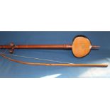 Single string musical instrument made from a coconut with bow