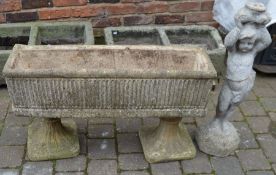 Raised concrete planter & a statue