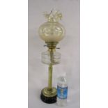 Oil lamp with glass shade and chimney also a full bottle of paraffin