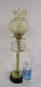 Oil lamp with glass shade and chimney also a full bottle of paraffin