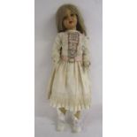 3ft antique composition walking doll with dress and petticoats - head turns with leg movement