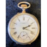 Patek Philippe pocket watch in a Swiss case (stamped 900) inner silver case engraved with retailer