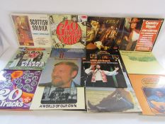 Collection of 12" vinyl records includes - Patsy Cline, Petula Clark, Elvis, Status Quo, Cliff