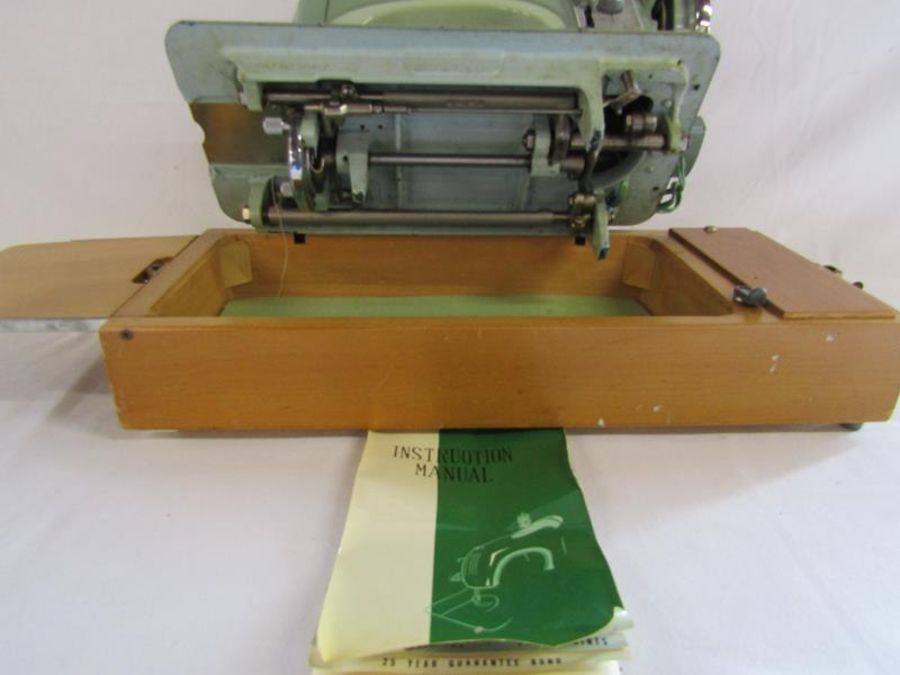 Musical Sunlik sewing machine includes attachments and instructions (no power or foot pedal) - Image 8 of 13