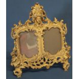 Decorative gilt metal double aperture picture frame with registration number to reverse 30cm wide