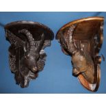 Late 19th / early 20th century Black Forest corner bracket shelf carved with the head of a