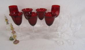 Red glass wine glasses, crystal glasses and 2 scent bottles