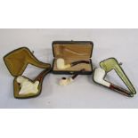 Collection of Meerschaum pipes includes eagle, and ball and claw