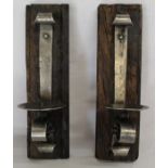 Two polished metal and wood wall mounted candle sconces