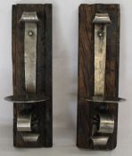 Two polished metal and wood wall mounted candle sconces