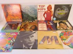 Collection of 12" vinyl records to include Top of the Pops, John Denver, Super Hits singles and