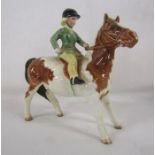 Beswick girl in green riding jacket on skewball pony No 1499 designed by A Gredington