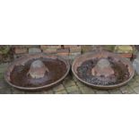 Pair of sombrero Mexican hat cast iron pig feeders. Dia 88cm