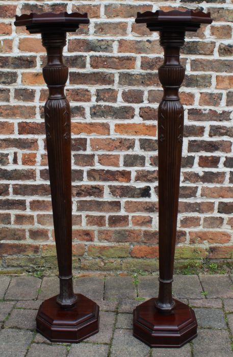 Pair of mahogany torcheres 127.5cm tall