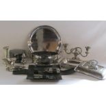 Collection of silver plate to include round tray, candlesticks and a ladies travelling set in case