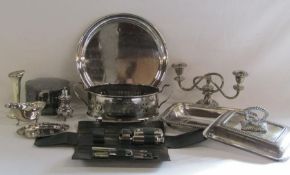 Collection of silver plate to include round tray, candlesticks and a ladies travelling set in case