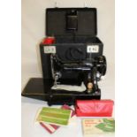 Singer electric sewing machine, model 222K, in original box with papers & accessories